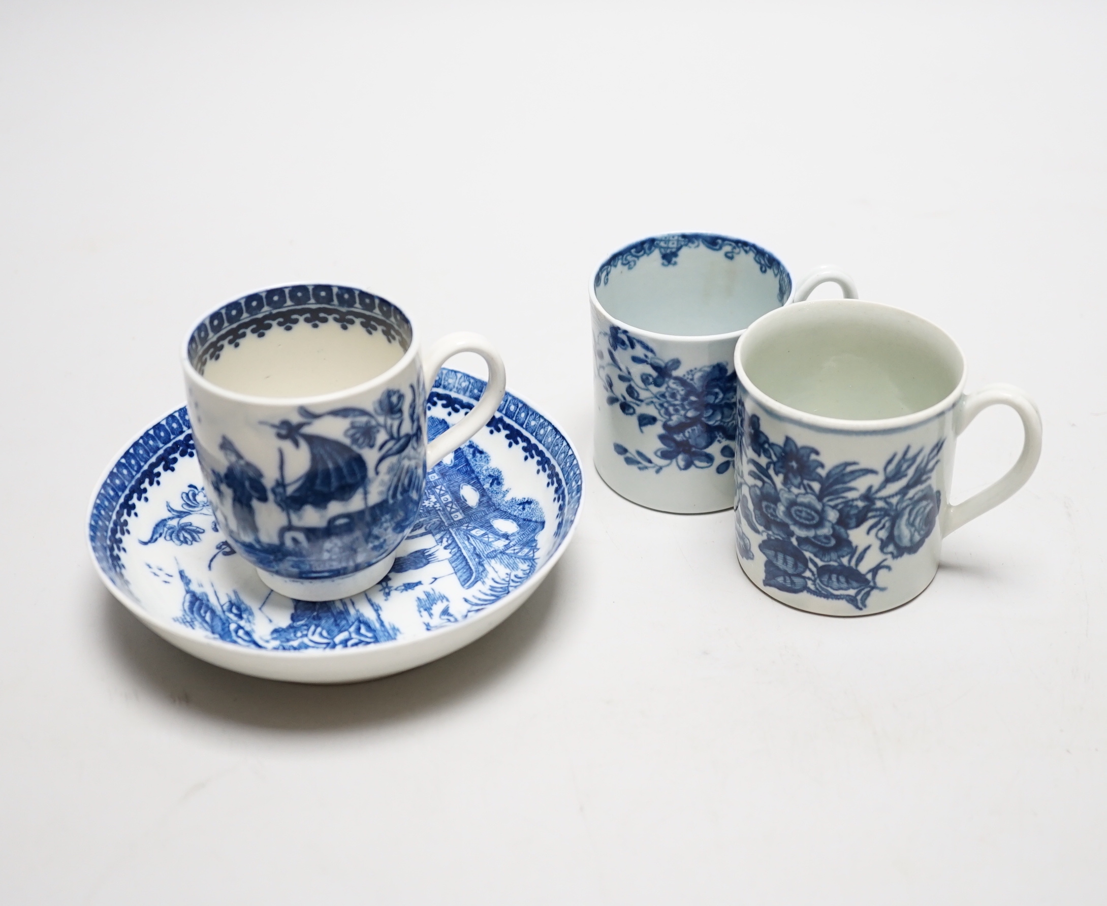 Two Worcester coffee cans, Mansfield and Three Flowers patterns, and a Worcester/Caughley coffee cup and saucer, Fisherman and Cormorant pattern